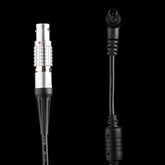 Close-up of 6-pin Lemo connector and right-angle DC barrel plug on DJI RS2 to Sony FX6 FX9 power cable with inline voltage regulator