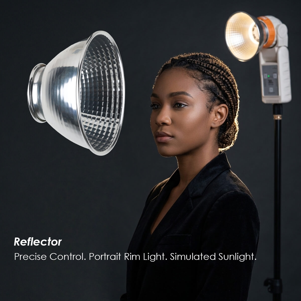 Reflector attachment on 30W bi-color LED light creating portrait rim light on model in studio setting