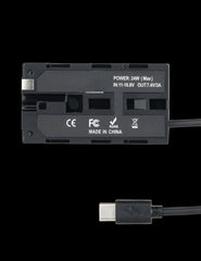 Rear view of NP-F dummy battery plate showing 24W max power rating 7.4V 3A output and USB-C PD connector with CE FCC RoHS certification